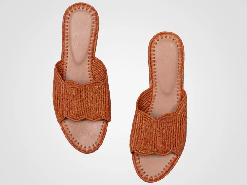 Handwoven Raffia Slippers in terracotta color, made with natural Raffia Palm leaves and genuine leather, showcasing Moroccan craftsmanship.